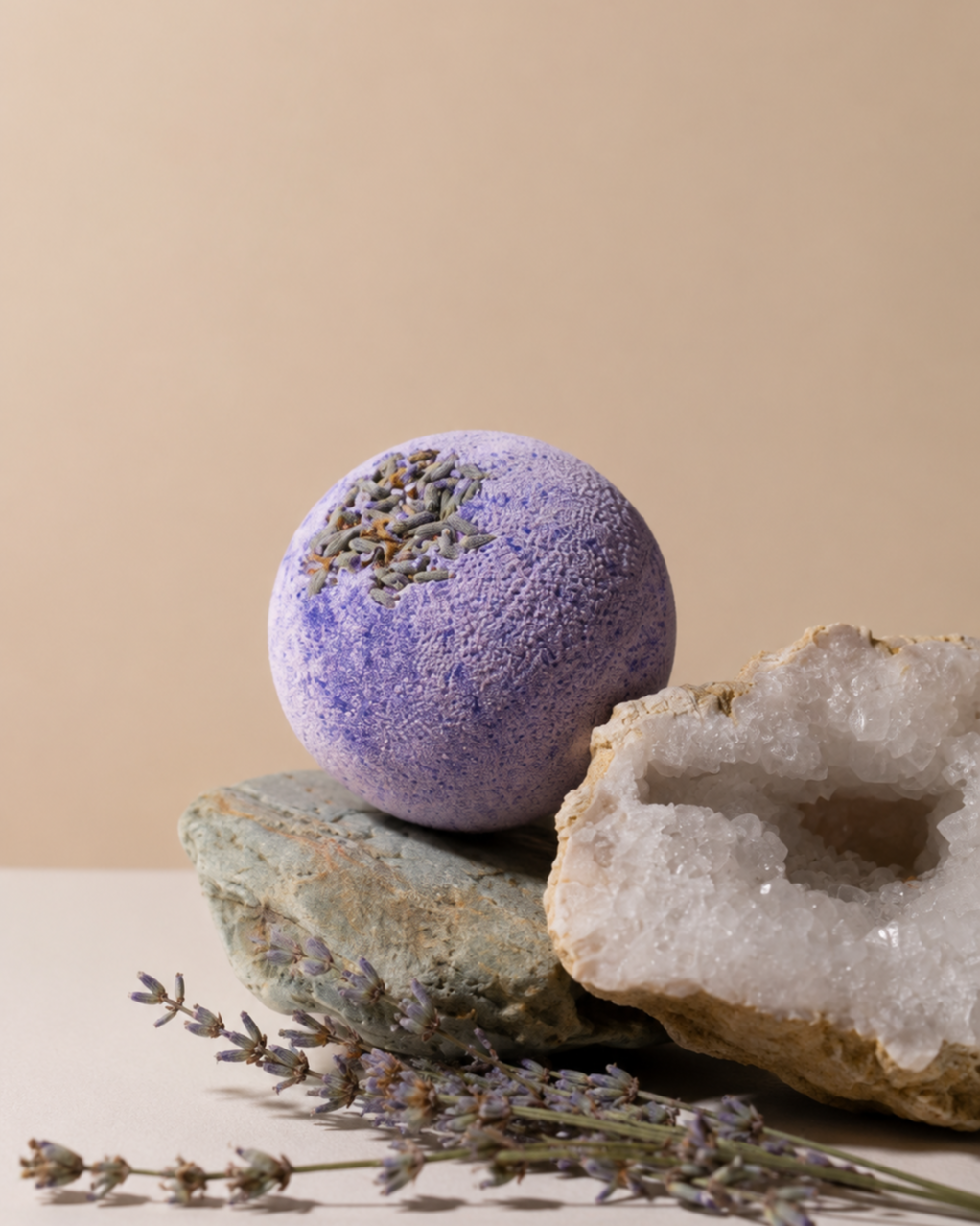 Lavender bath bomb styled with a geode and lavender sprigs
